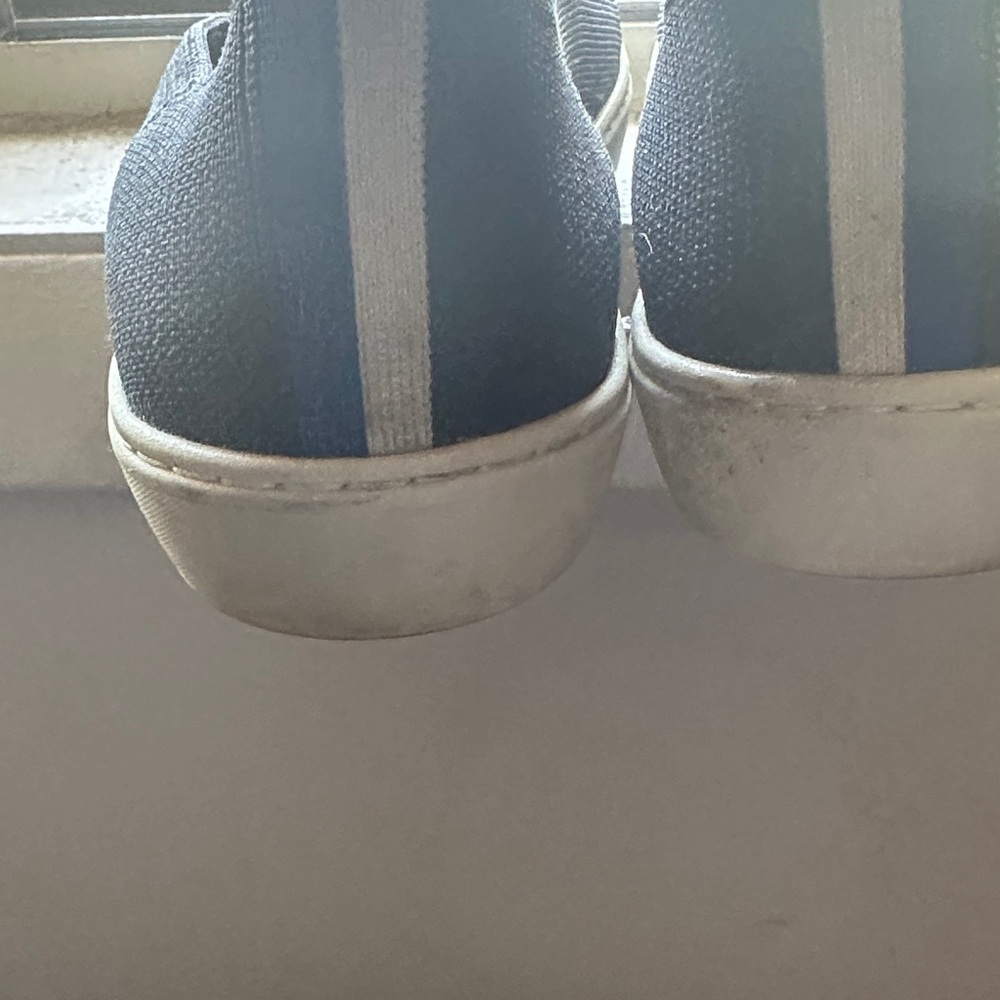 Rothy's black with Blue and White stripe on back Sneakers